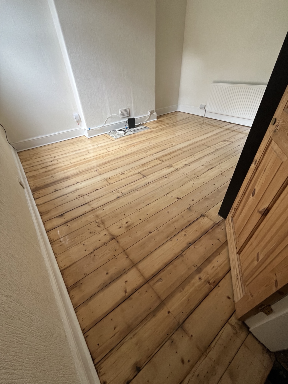 Restored pine floor after sanding and refinishing