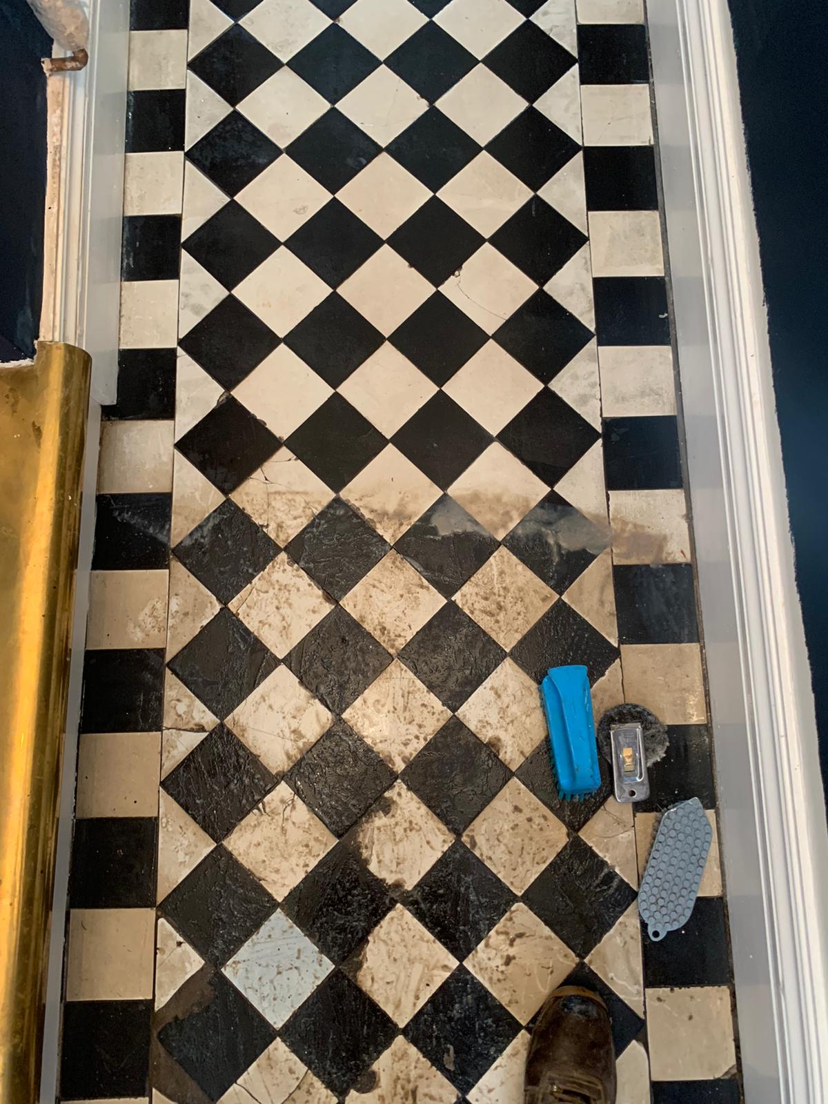 Victorian tiled floor before restoration